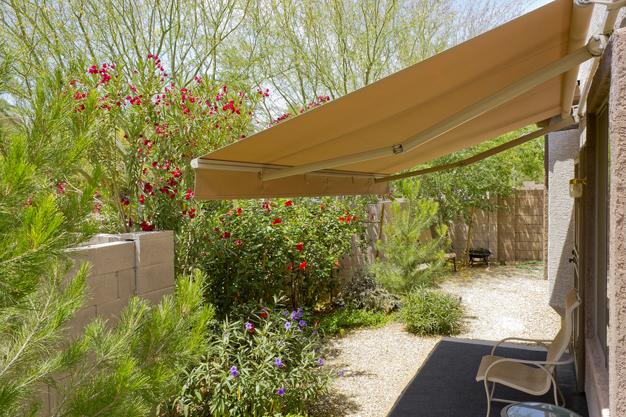 Motorized retractable awning shading a residential patio in Chesterfield, VA