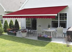 Red color awning outside the house