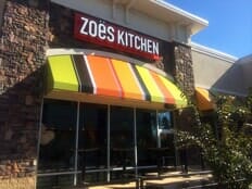 Colorful awning over the door of Zoe's Kitchen restaurant